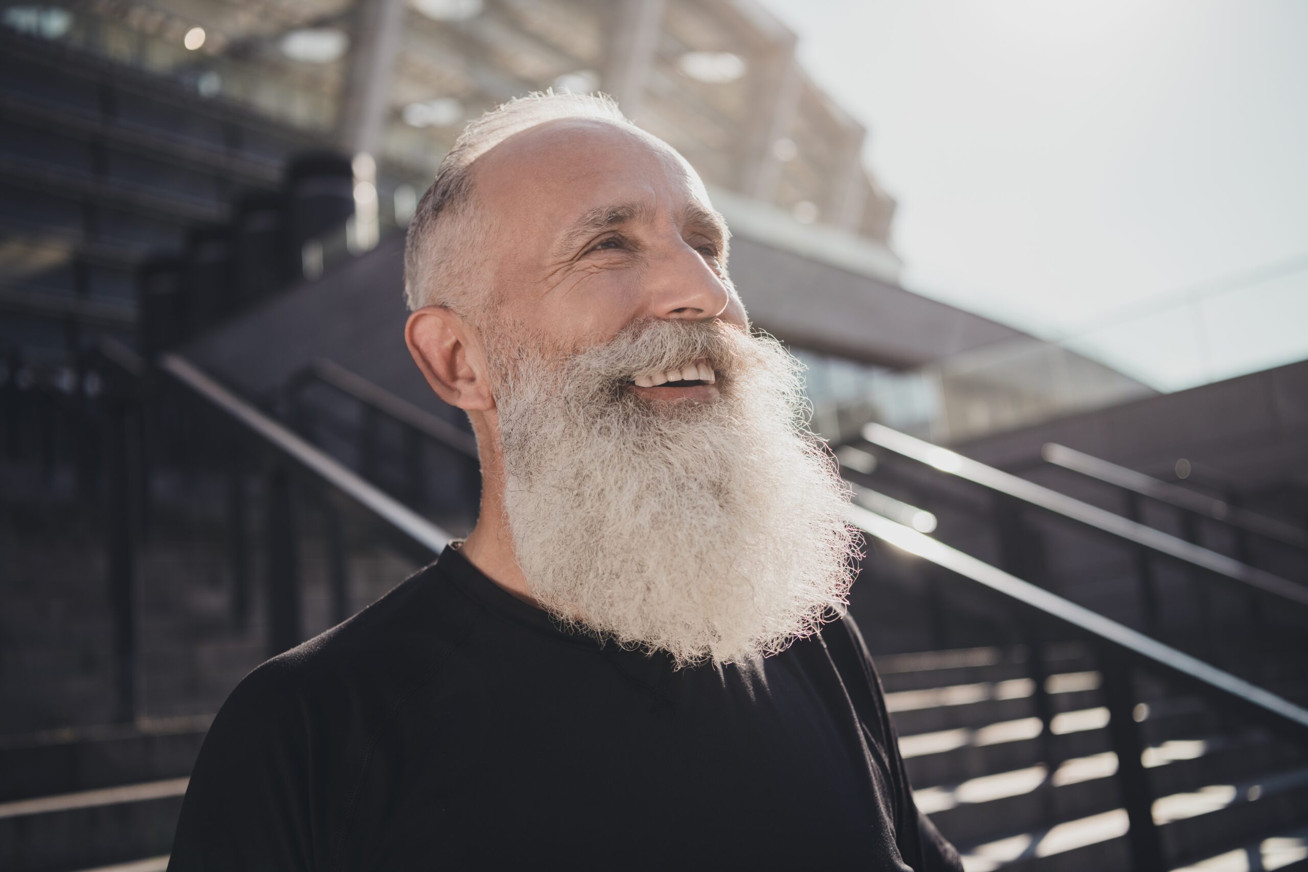 Smiling older man with a full white beard